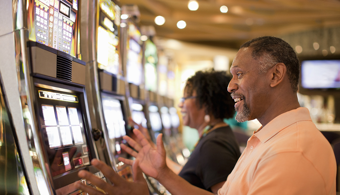 couple smiling while playing games at a casino