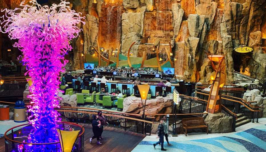 people walking inside the colorful Mohegan Sun Resort
