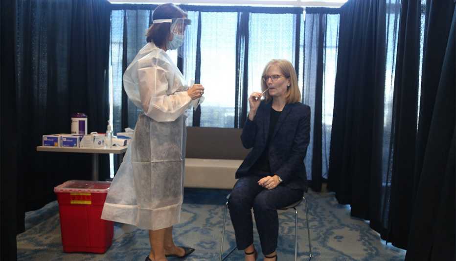 A Tampa International Airport female employee gets tested for COVID-19
