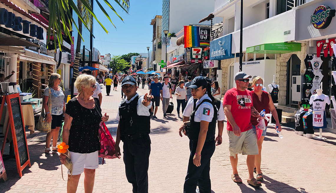 Police offers give instructions to tourists.