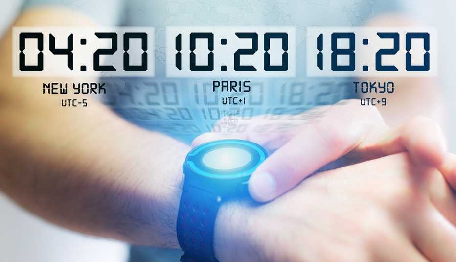man using smart watch displaying various times