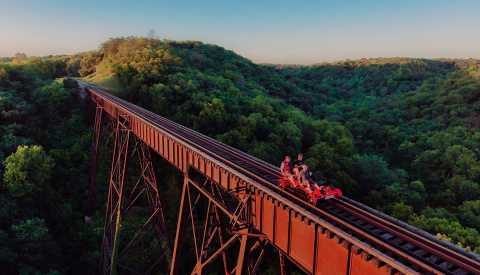 people in boone iowa riding a rail car on an open railroad track people in boone iowa riding a rail car on an open railroad track
