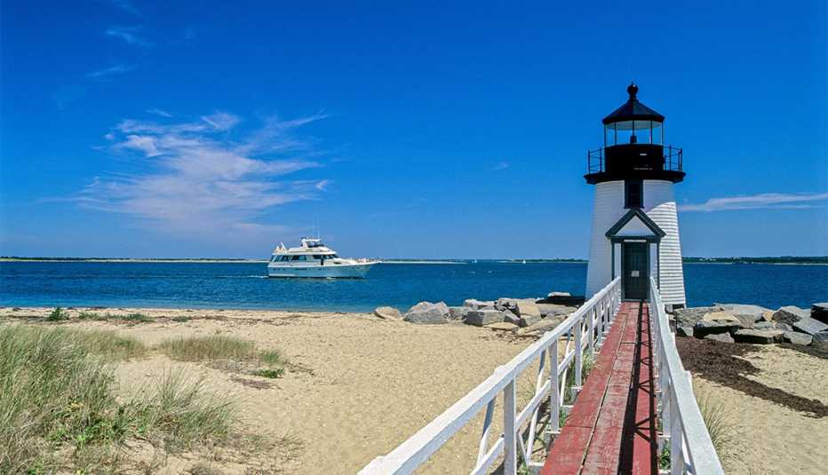 Brant Point Light and cabin cruiser yacht in Nantucket 