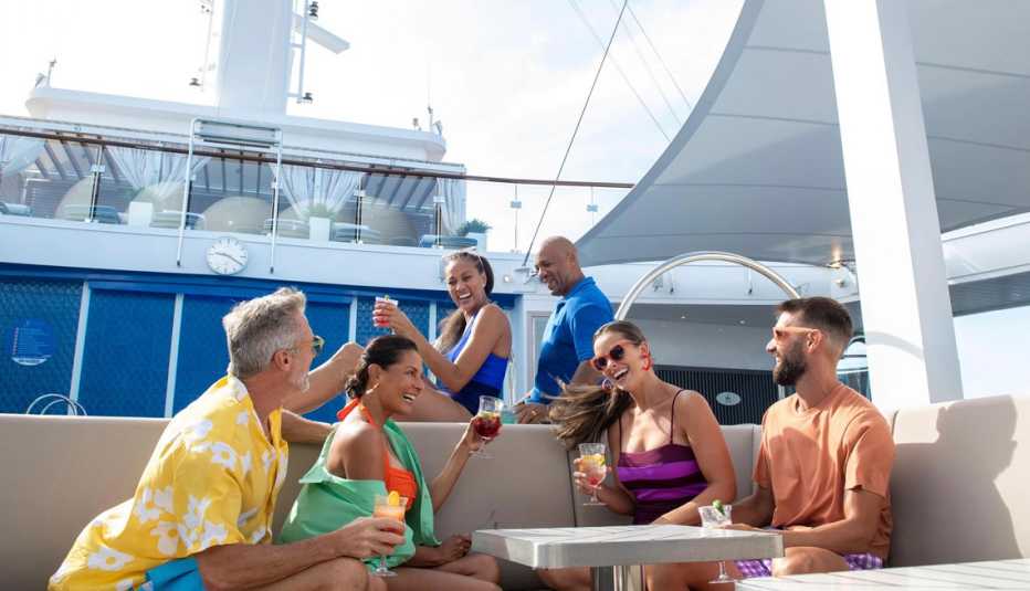 people having fun on the adults only deck of the mardi gras carnival cruise ship