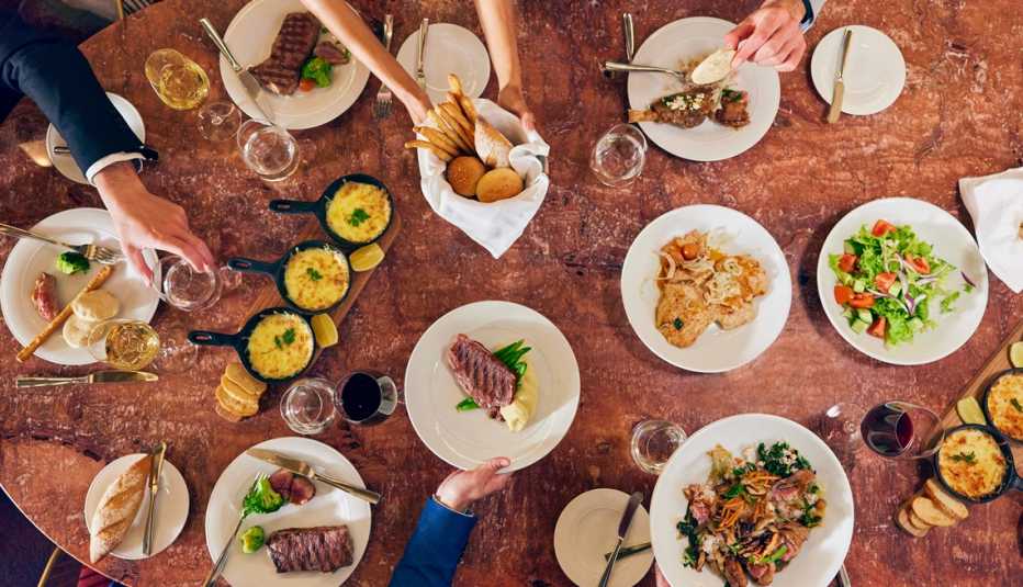 a table covered in different dishes on a celebrity beyond cruise ship