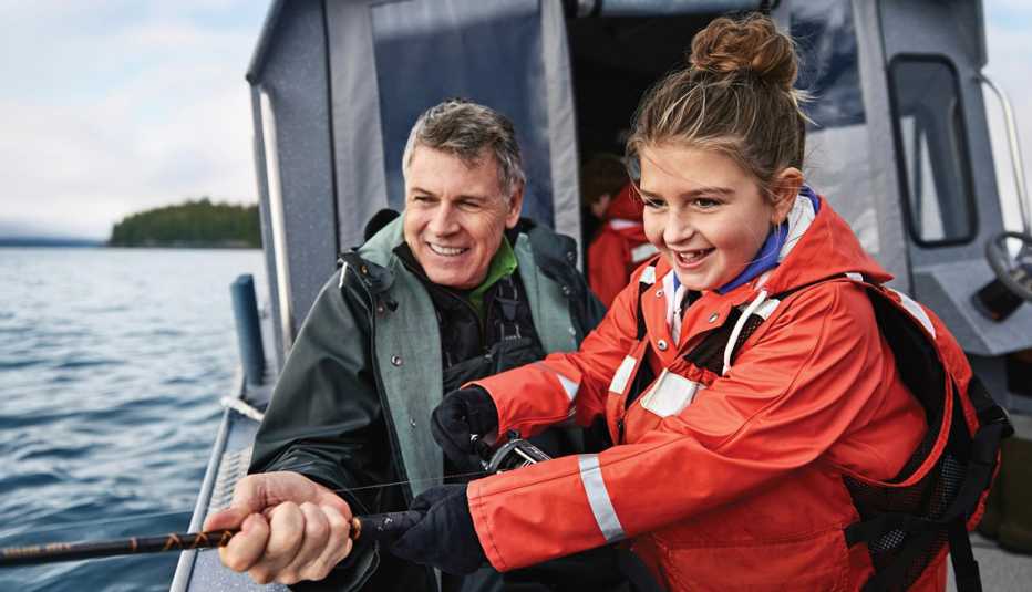 a father and daughter salmon fishing on a princess cruise stop in alaska