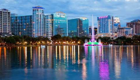 orlando city skyline over lake eola in florida orlando city skyline over lake eola in florida
