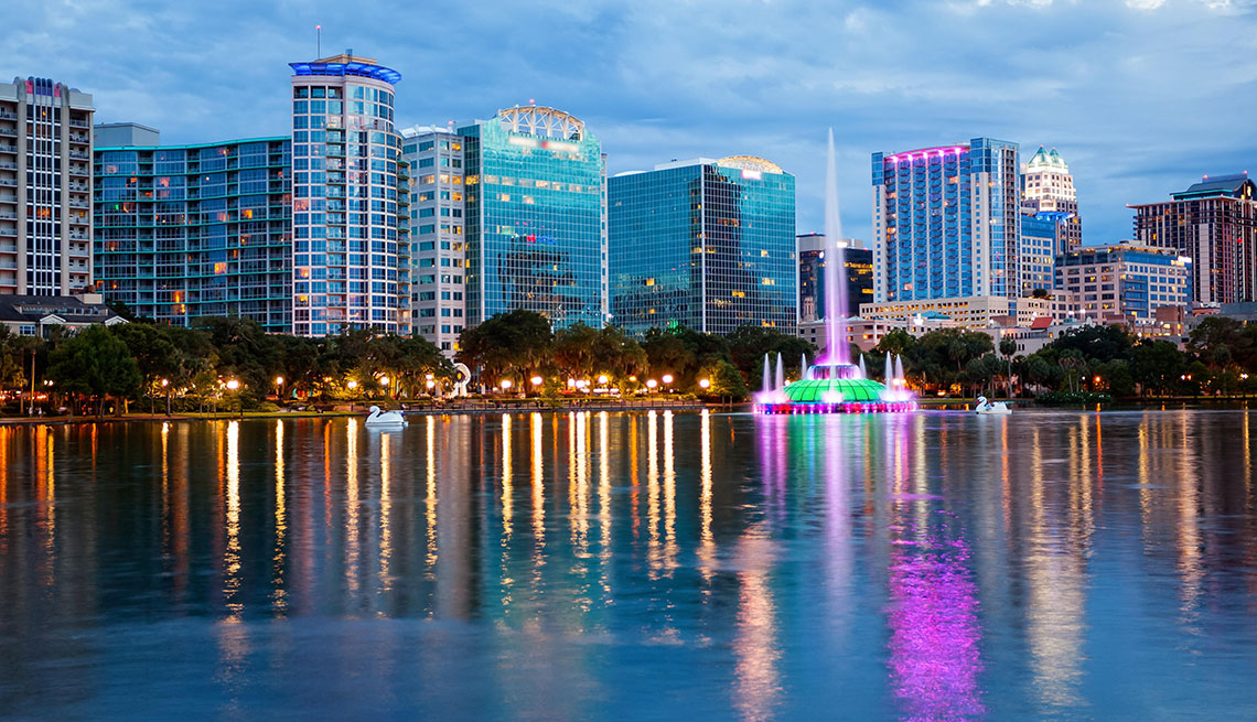 orlando city skyline over lake eola in florida