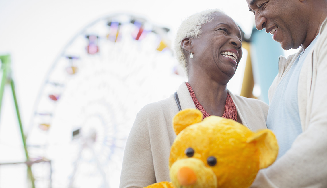 couple smiling at amusement park