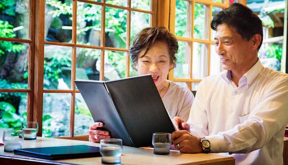 couple looking at a menu at a restaurant