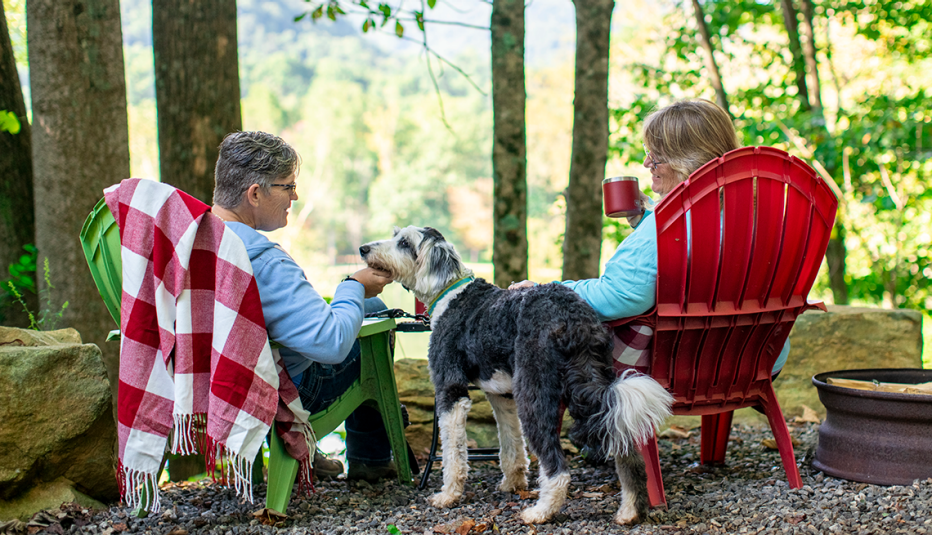 a couple camping in asheville north carolina with their dog