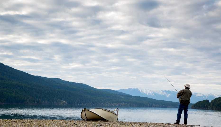 man fishing at a lake in Whitefish