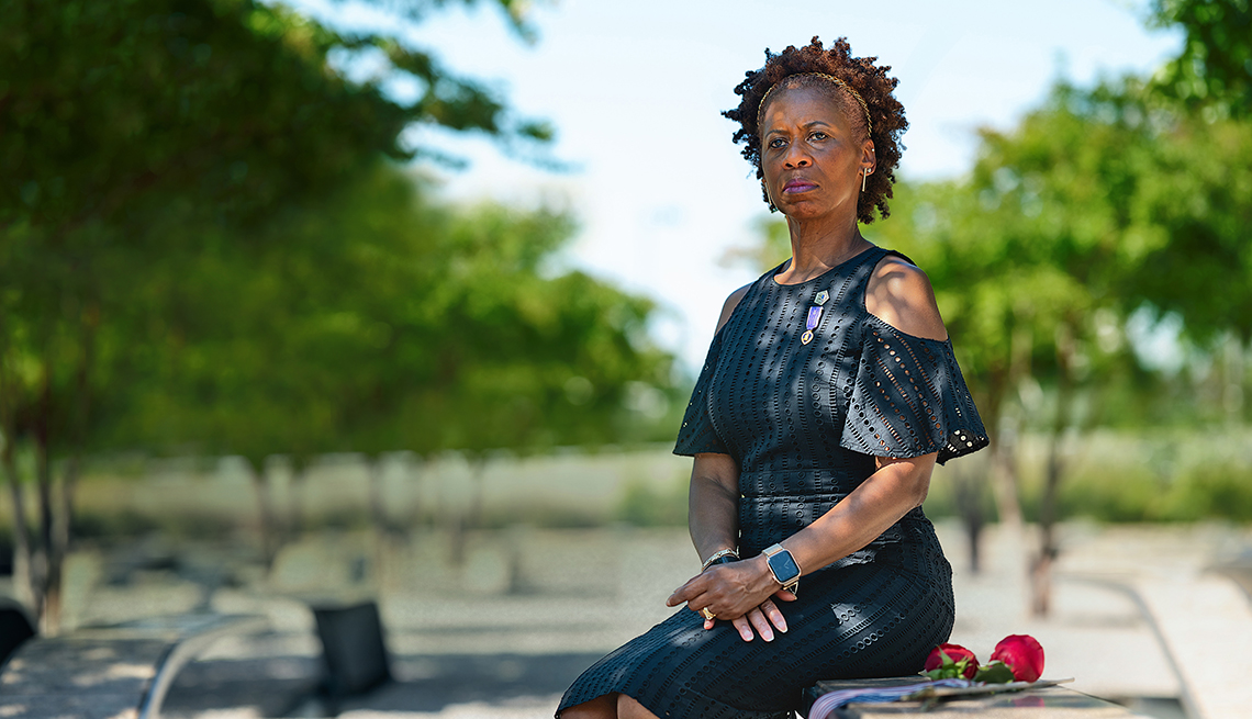 Retired Army Col. Marilyn Wills sits on a bench at the Pentagon 9/11 Memorial that honors her former officemate, Marian Serva, who was a congressional affairs contact officer for the Army that died in the 9/11 attack on the Pentagon, in Arlington, Va., on Tuesday, August 23, 2022. Col. Wills was working at the Pentagon on Sept. 11, 2001, when a highjacked airplane crashed into the building. She helped lead people to safety, including a woman she carried on her back