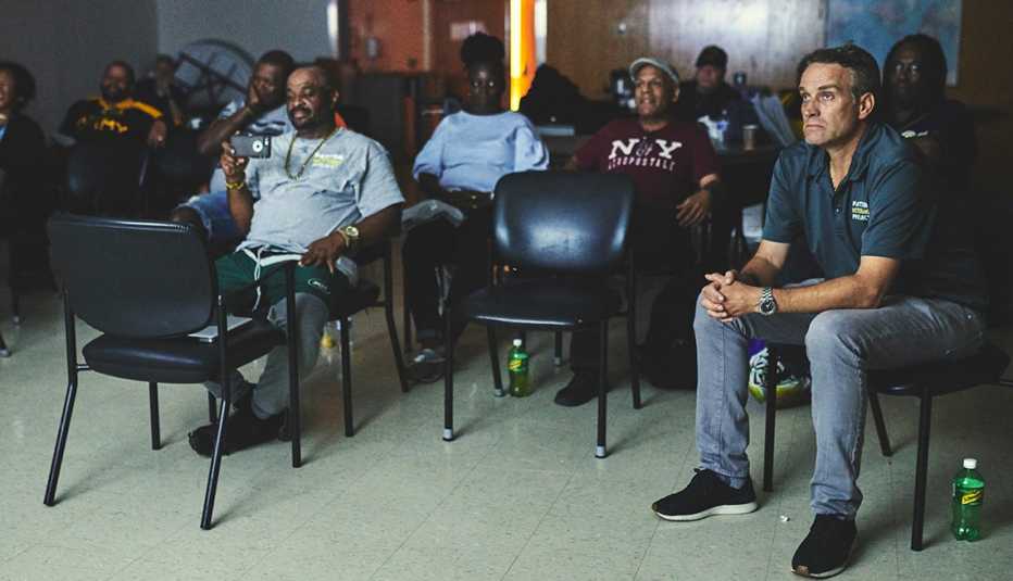 Ben Patton sits in a chair