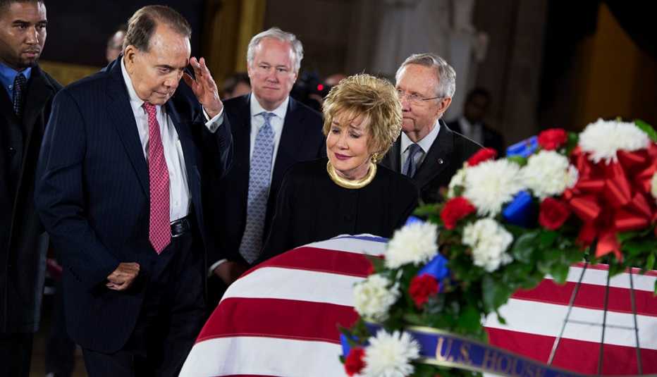Bob Dole salutes the casket of Daniel Inouye