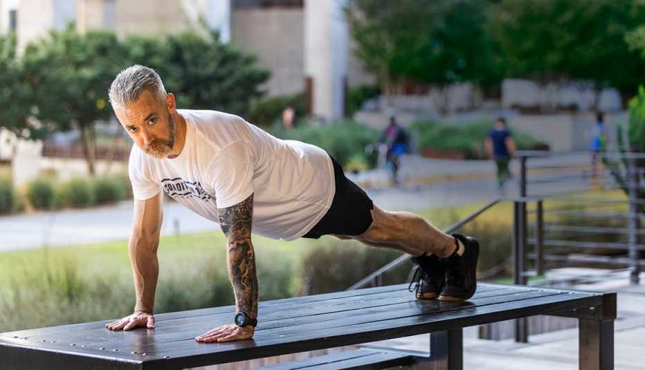 a man is in a plank movement