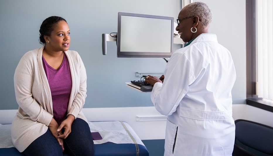 A doctor is speaking to a patient A doctor is speaking to a patient