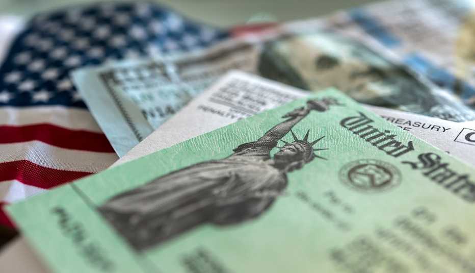 A check from the U S Treasury on an American Flag A check from the U S Treasury on an American Flag