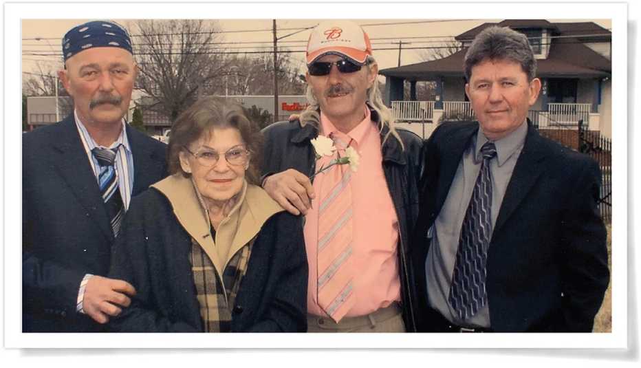 Brothers Kenneth, Bruce and Ted with their mother.
