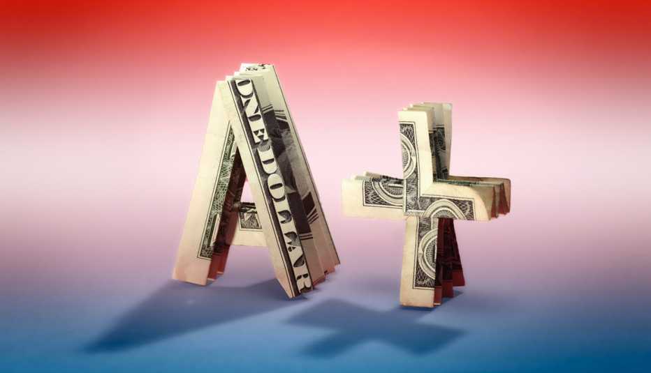 Find financial literacy dollar bills in the shape of an a plus grade
