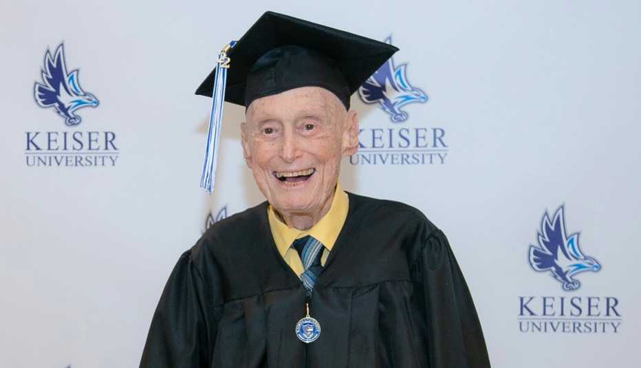 veteran graduate bob blum in front of a keiser university wall