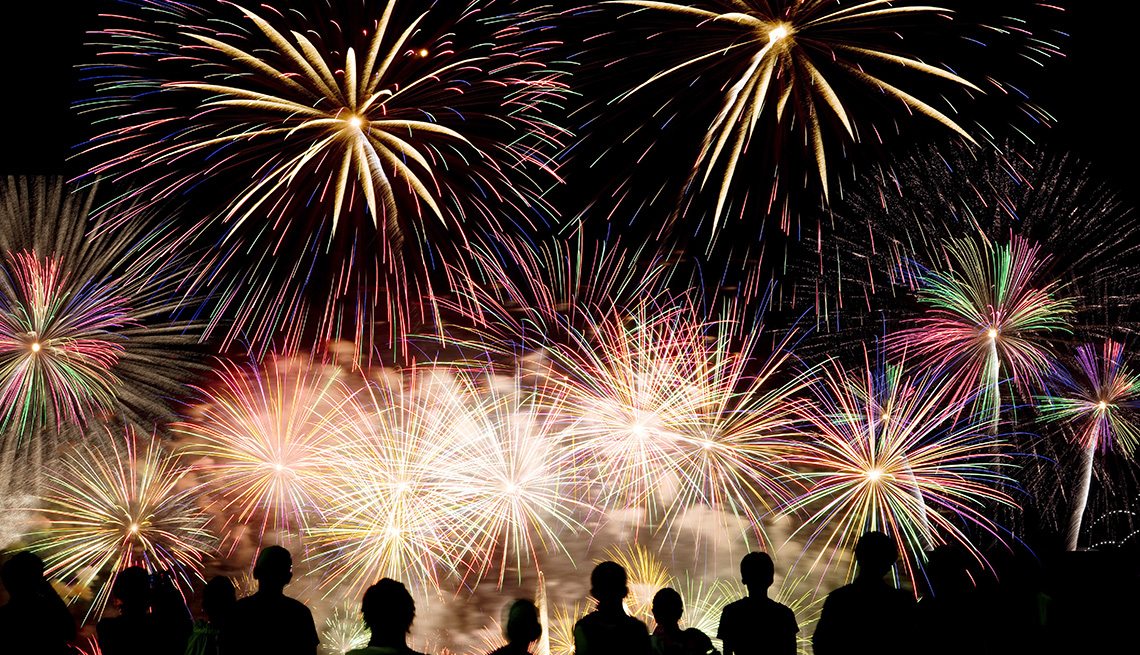 An audience watching fireworks in the sky