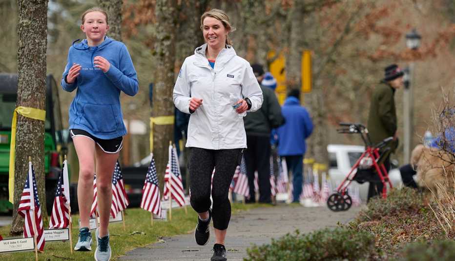 two women are jogging outside