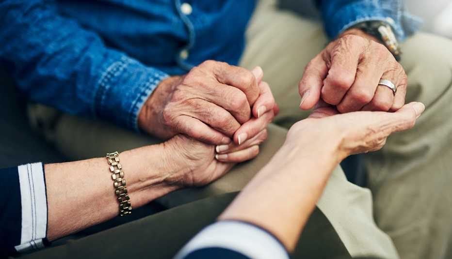 Cropped shot of a senior couple holding hands