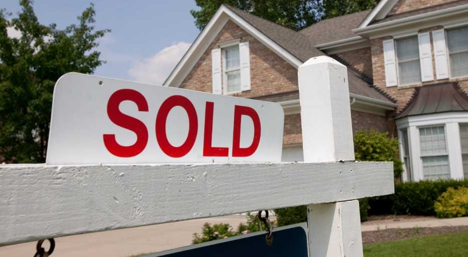 sold sign in front of a house