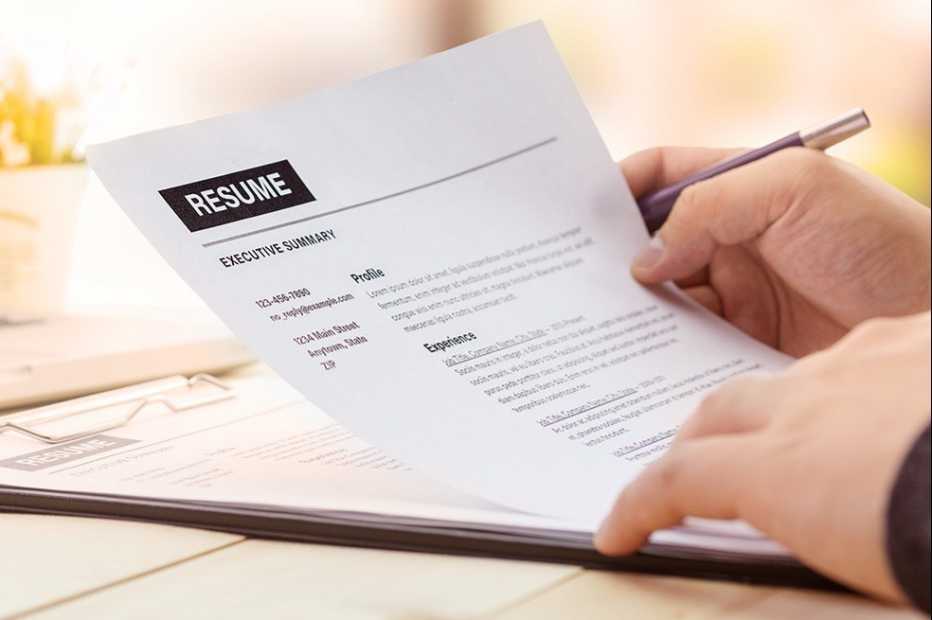 hands holding a resume