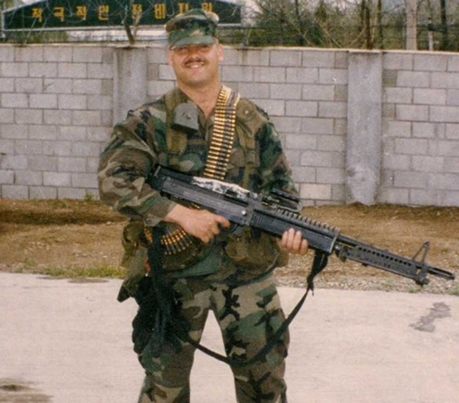 a man is holding a gun