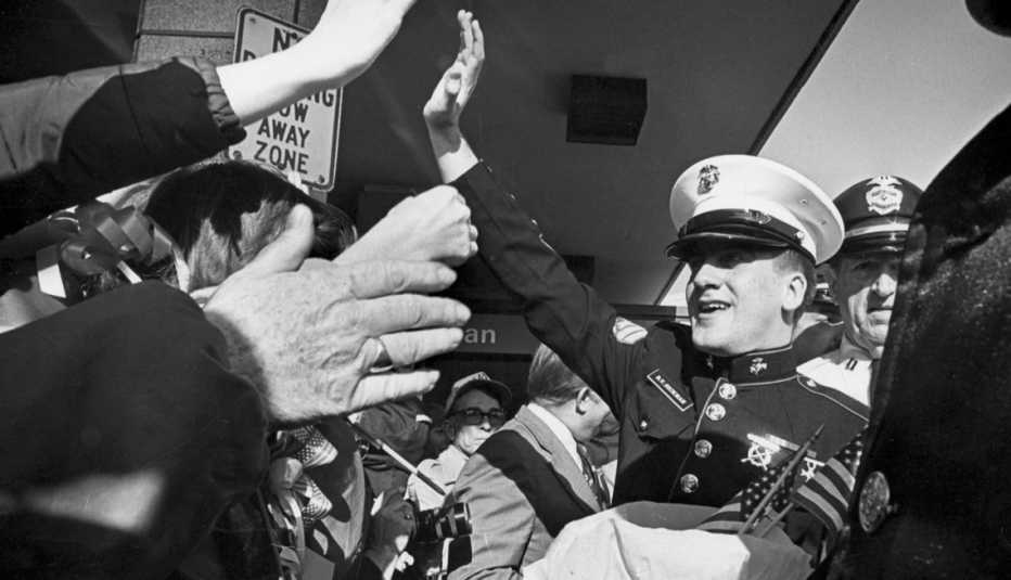 sergant rocky sickmann waves at people
