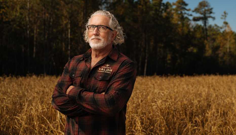 Brad Halling stands in a field.