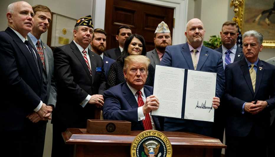 Presidenet Trump shows off an executive order