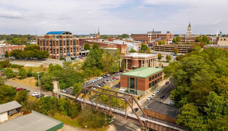 an aerial view of clarksville, tennessee shows an old railroad trestle that was turned into a pedestrian bridge.
