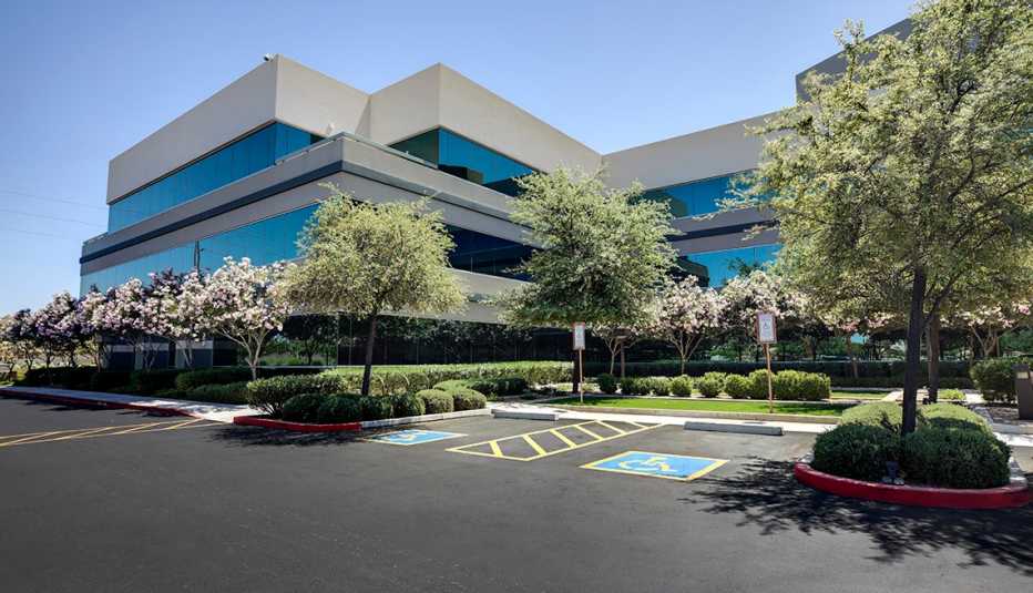 an office building is pictured in front of a blue sky