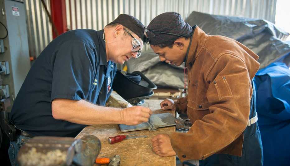 two people working on a table