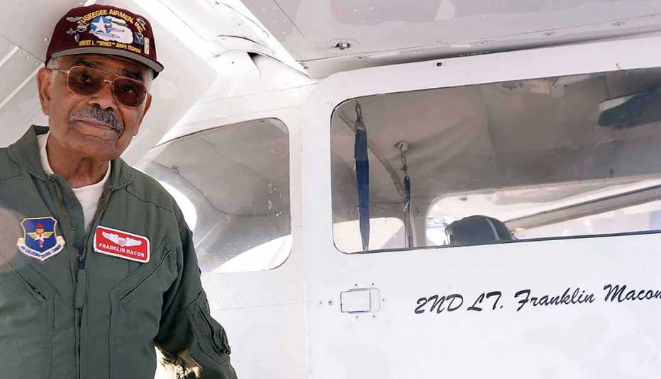 Frank Macon standing next to his airplane