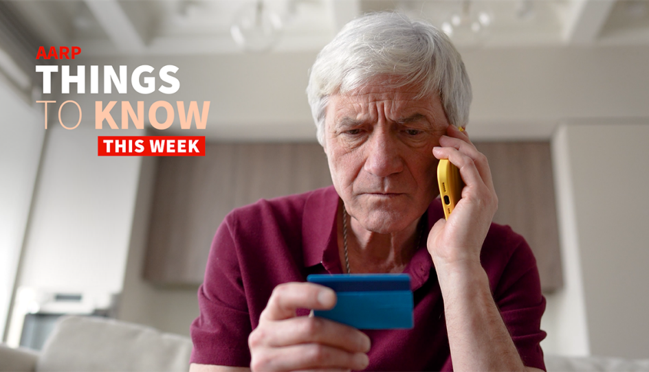 a man on his phone holding a credit card