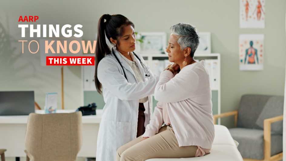 A doctor attends to an older patient sitting on the examining table