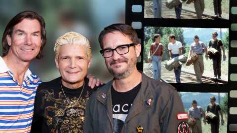 will wheaton, jerry o connell and corey feldman posing together in front of an enlarged film strip with images from stand by me