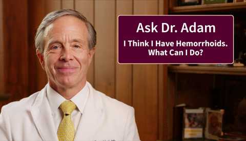 Doctor Adam looks at the camera next to a text card that says I think I have hemorrhoids. What can I do?