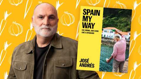 a photo shows José Andrés in front of a food-themed backdrop with an image of his Spain My Way cookbook inset to the right
