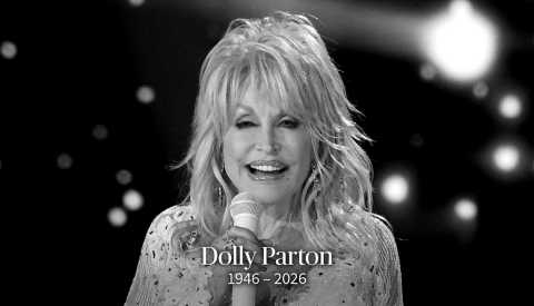 dolly parton holding a microphone