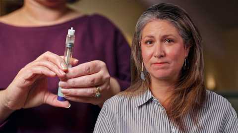 woman in foreground while another holds a GLP-1 injector