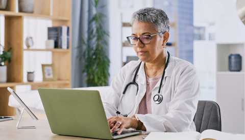 a doctor working on a computer