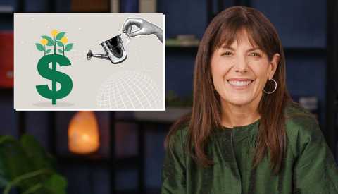 Jean Chatzky smiles next to a box showing a hand watering a plant in the shape of a dollar sign