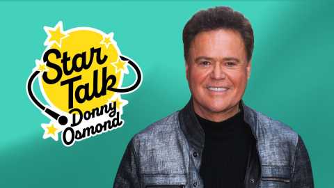 donny osmond smiling in front of a green background alongside a star talk logo
