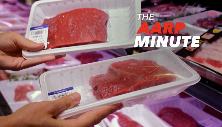a person comparing meat prices