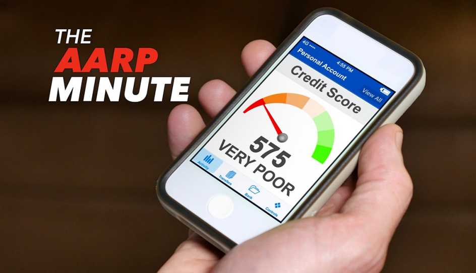 a person holds a smartphone with a meter that says credit score on it
